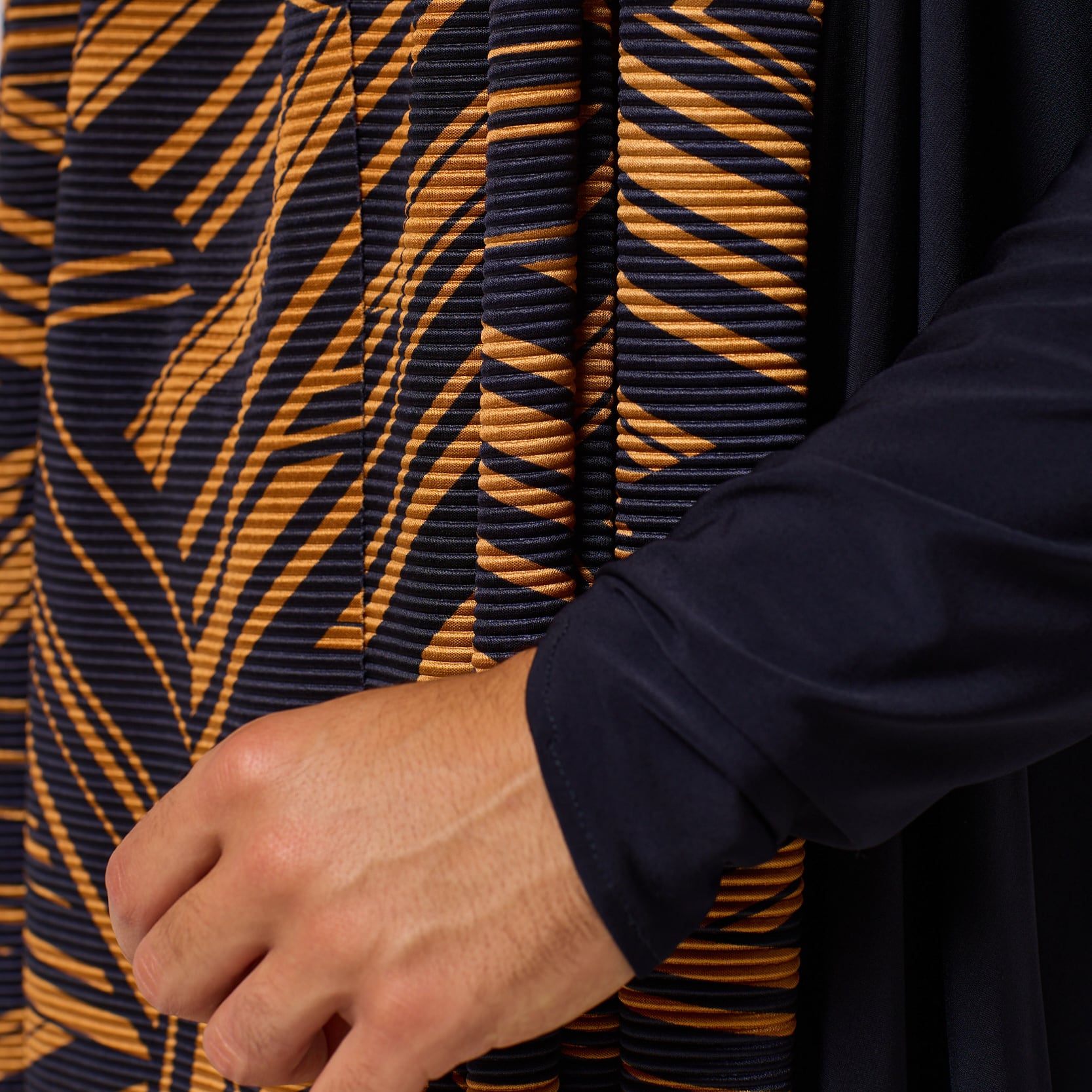 ZERØ London - Close up, mens zero waste long sleeve jersey cardigan in navy with gold geometric print designed & made in London