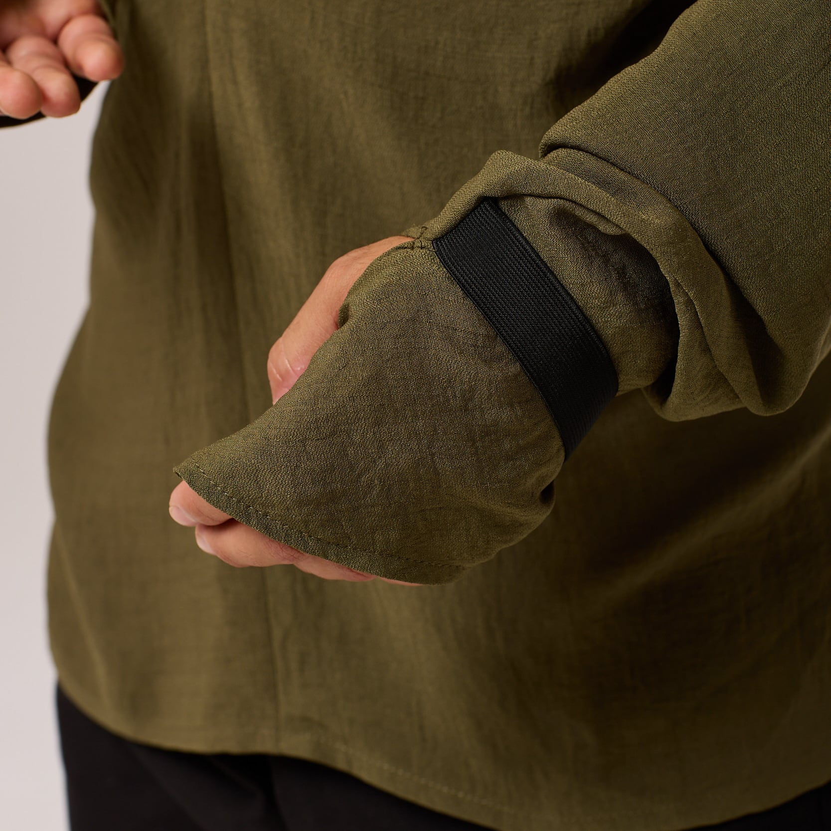   ZERØ London - Close up view, olive green long sleeve mens zero waste shirt designed & made in London