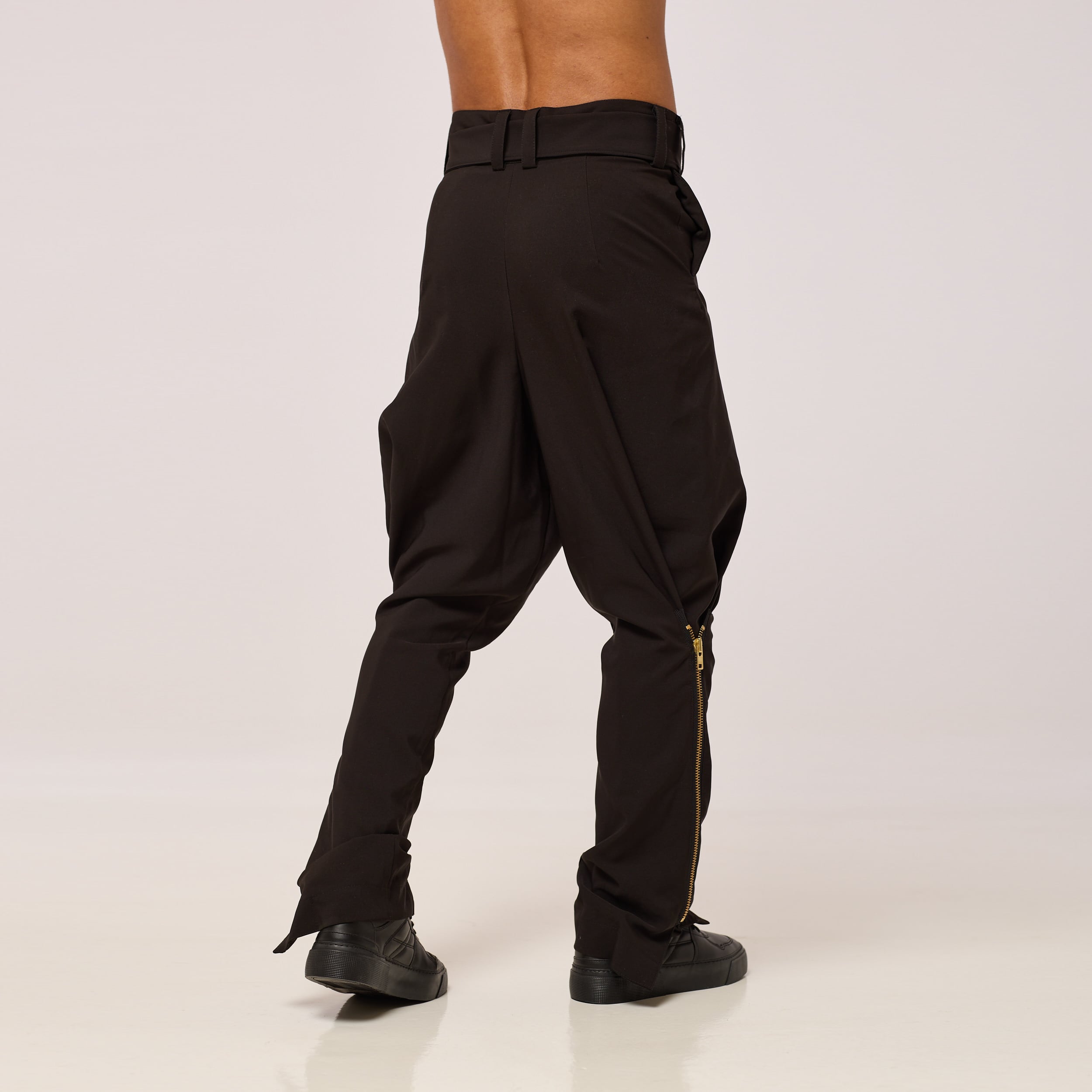ZERØ London - Back full length view. Mens zero waste tapered trouser with gold zips designed & made in London