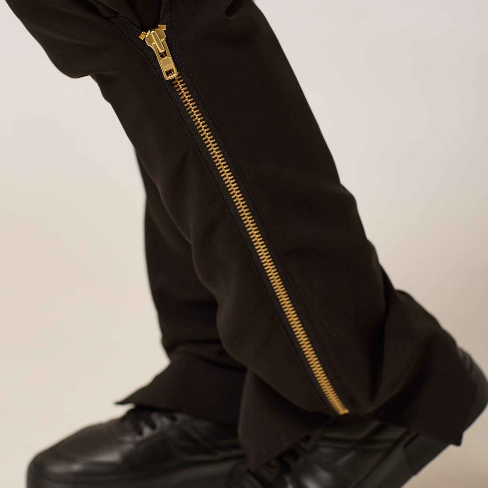 ZERØ London - Alt. close up. Mens zero waste tapered trouser with gold zips designed & made in London