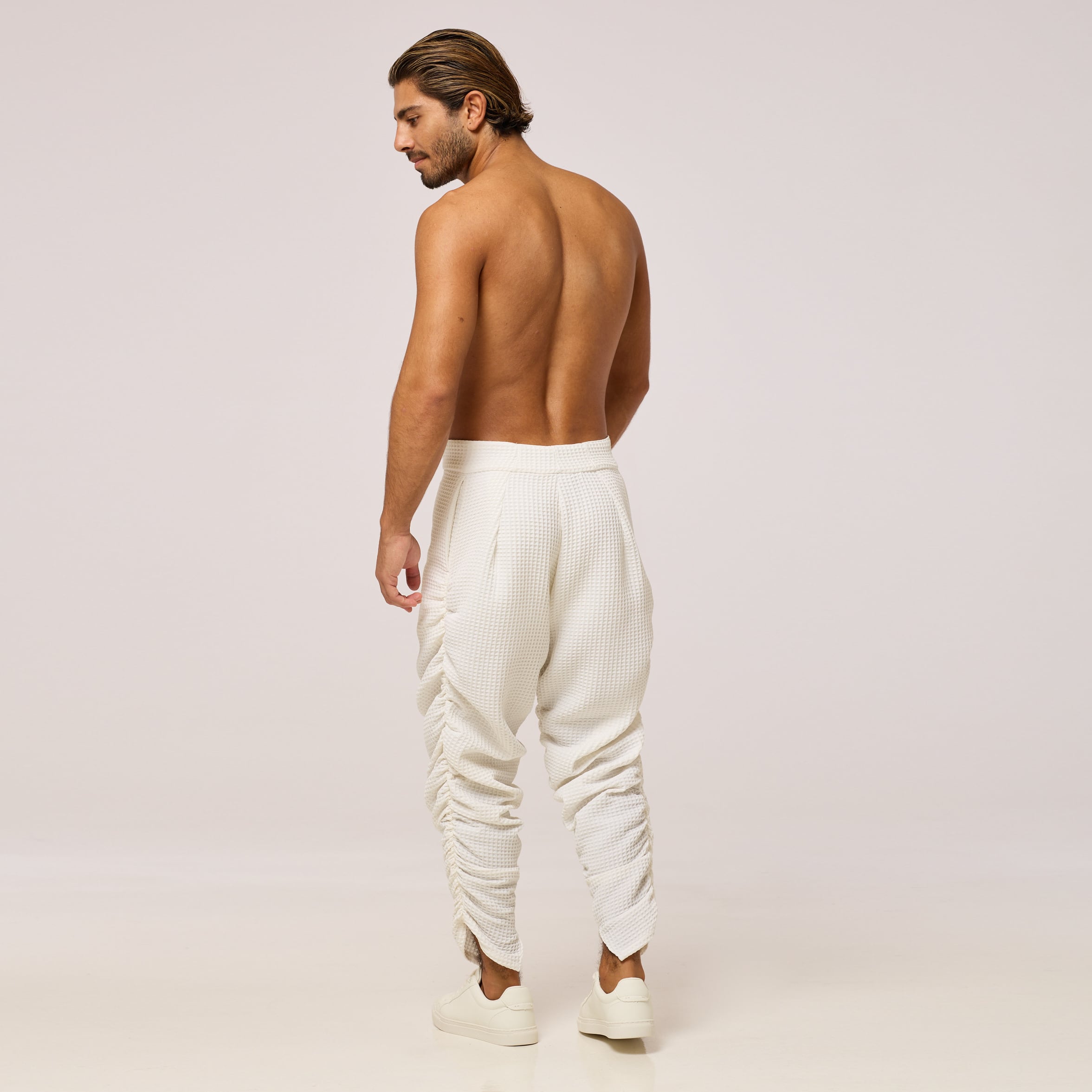 ZERØ London - Back full length view. Mens zero waste tapered trouser with gathers in white. Designed & made in London