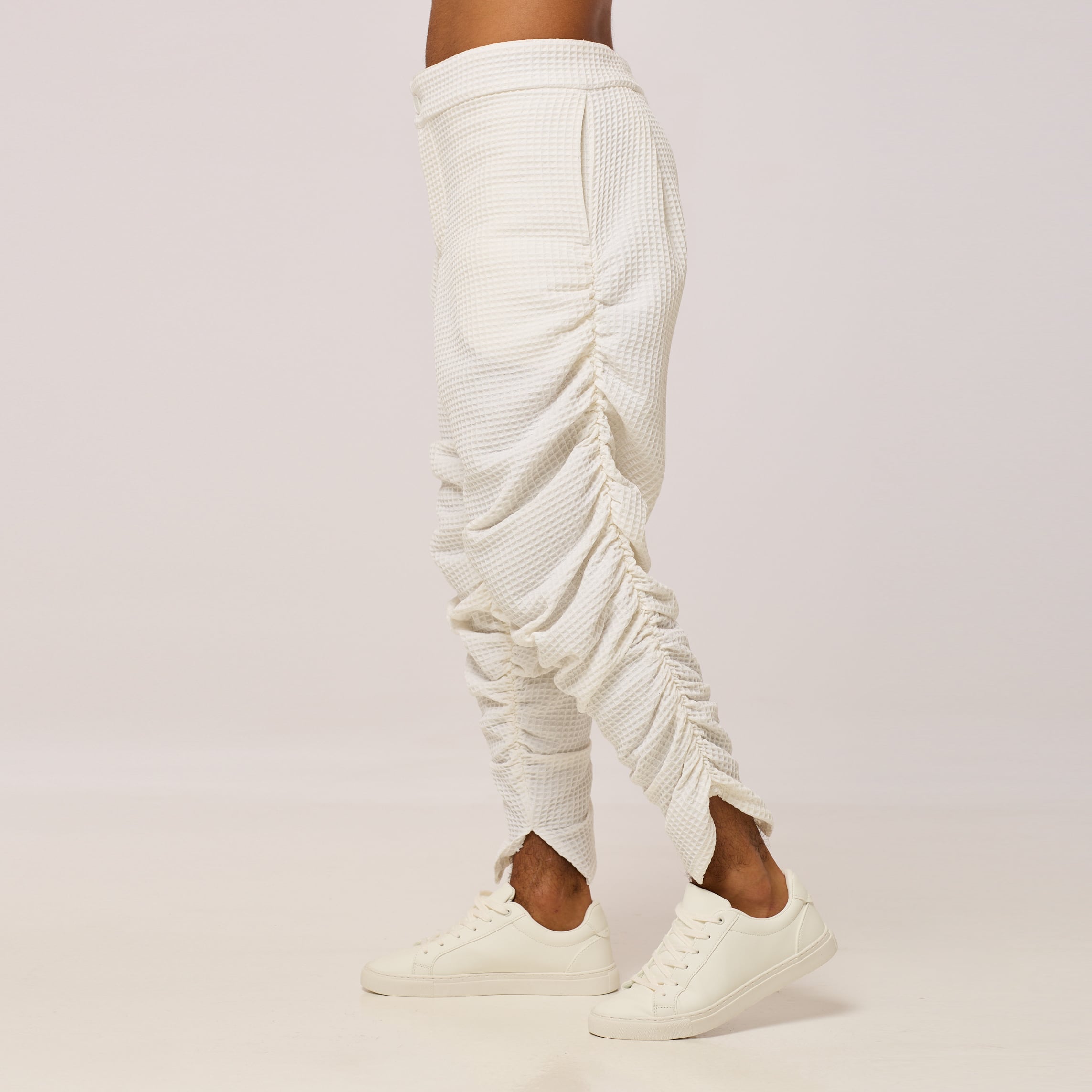 ZERØ London - Front mid-length view. Mens zero waste tapered trouser with gathers in white. Designed & made in London