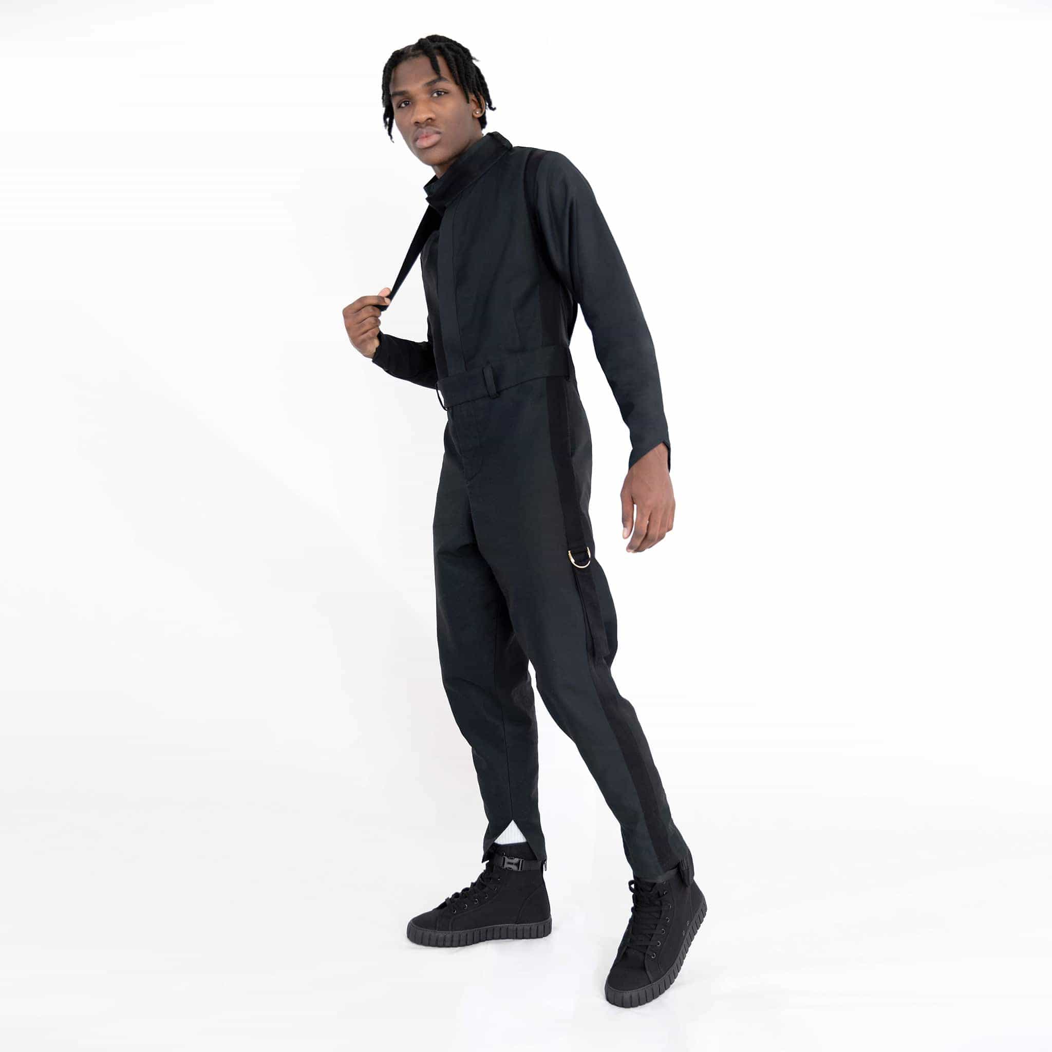 ZERØ London - Side full length view, mens zero waste jumpsuit in black with black contrast stripe and D-rings, designed & made in London