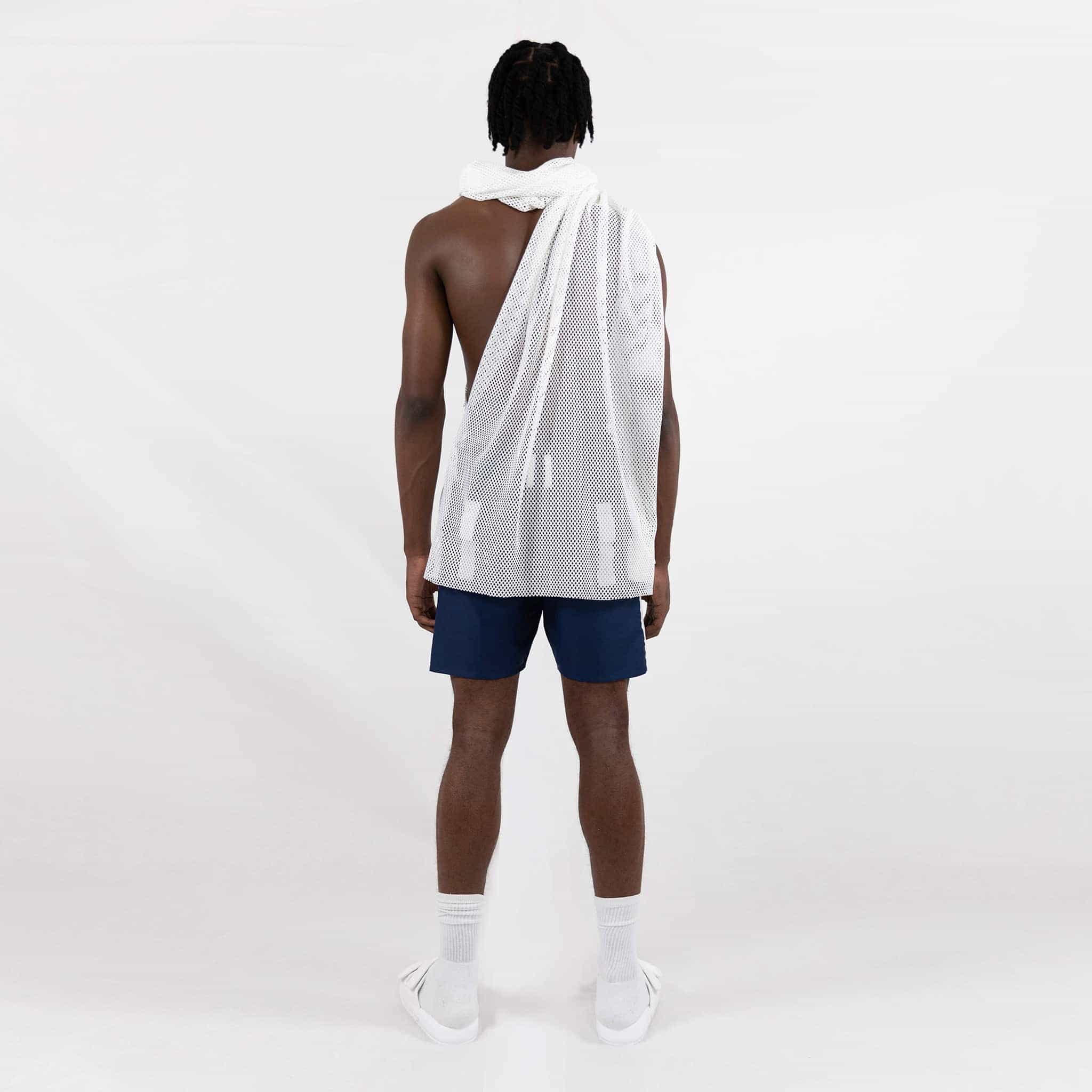 ZERØ London - Back full length view. Mens zero waste vest in white fishnet designed & made in London